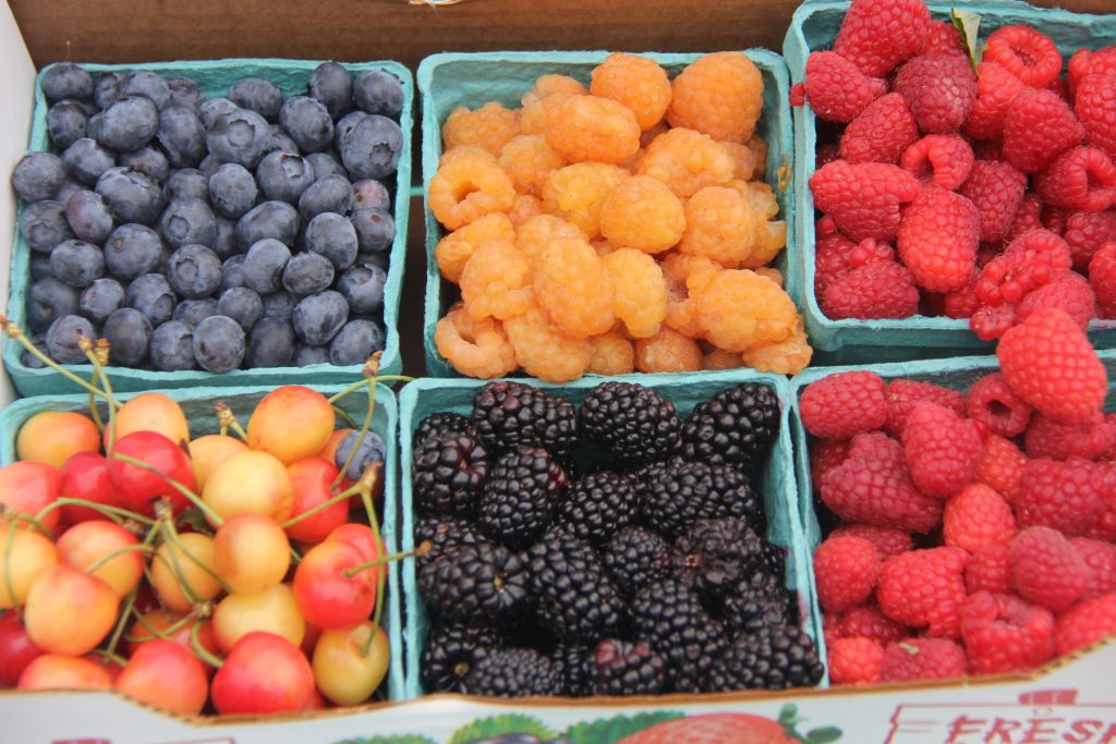 Various berries in pint containers.